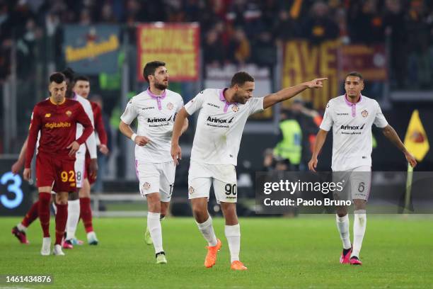 Cyriel Dessers of US Cremonese celebrates after scoring the team's first goal during the Coppa Italia Quarter Final match between AS Roma and US...