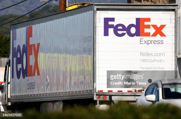 The FedEx logo is displayed on a FedEx delivery truck on February 1, 2023 in Los Angeles, California. FedEx is reportedly laying off over 10 percent...