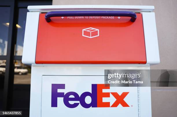 The FedEx logo is displayed on a drop box at a FedEx ship center on February 1, 2023 in Los Angeles, California. FedEx is reportedly laying off over...