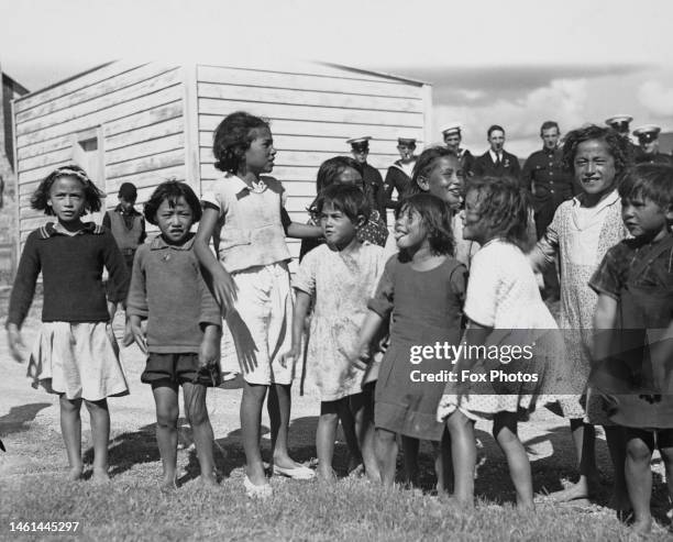 Group of Māori children performing a haka, Rotorua, New Zealand, circa 1935.