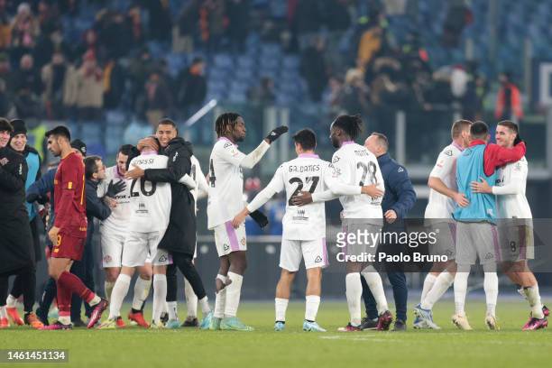 Players from US Cremonese celebrate victory at the end of the Coppa Italia Quarter Final match between AS Roma and US Cremonese at Olimpico Stadium...