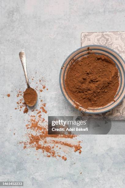 bowls of cocoa powder - brown powder stock pictures, royalty-free photos & images