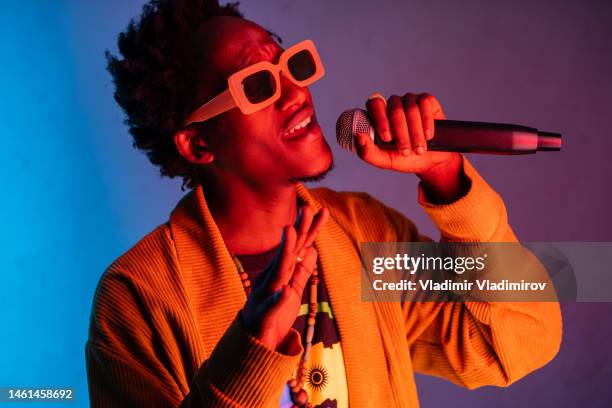 singing, performing. african-american man - rap singer stock pictures, royalty-free photos & images