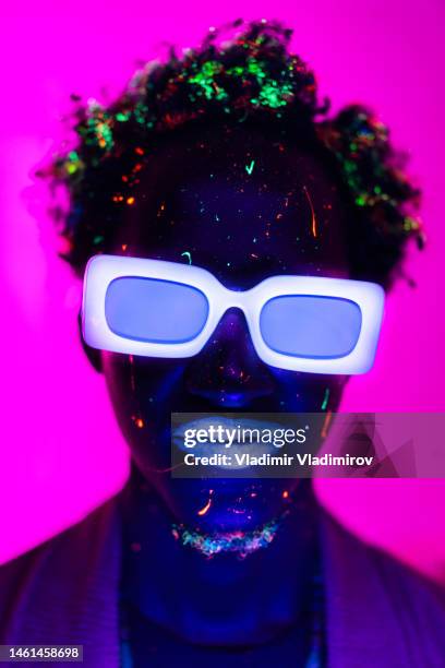 anonymous man in ultraviolet light - artists model stock pictures, royalty-free photos & images