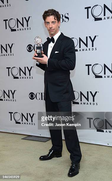 Christian Borle poses in the 66th Annual Tony Awards press room at The Beacon Theatre on June 10, 2012 in New York City.