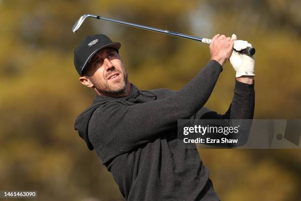 Retired NFL quarterback Alex Smith hits a shot during the Cisco Million Dollar Hole-in-One for Charity Challenge prior to the AT&T Pebble Beach...