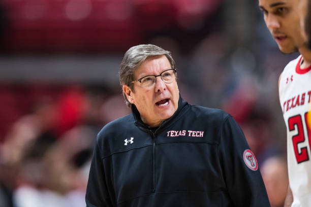 Head coach Mark Adams of the Texas Tech Red Raiders talks with guard Jaylon Tyson during the second half of the college basketball game against the...
