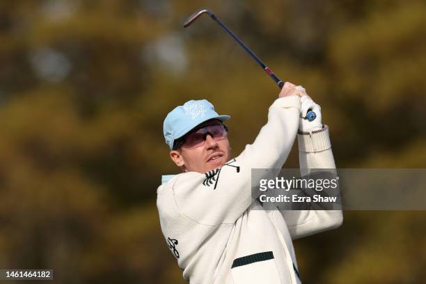 Rapper and songwriter Macklemore hits a shot during the Cisco Million Dollar Hole-in-One for Charity Challenge prior to the AT&T Pebble Beach Pro-Am...
