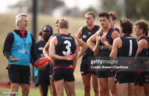 Bombers assistant coach Blake Caracella speaks with the players during an Essendon Bombers AFL training session at The Hangar on February 02, 2023 in...