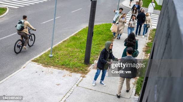 young woman pleading urban pedestrians for help, top view - surveillance camera stock pictures, royalty-free photos & images