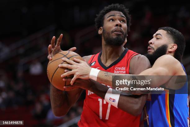 Tari Eason of the Houston Rockets drives to the net against Kenrich Williams of the Oklahoma City Thunder during the first half at Toyota Center on...