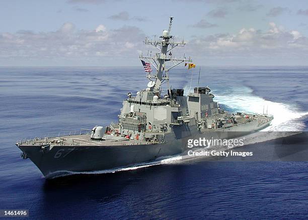 The Arleigh Burke class guided missile destroyer USS Cole is shown at sea approximately one month before being attacked by a terrorist-suicide...