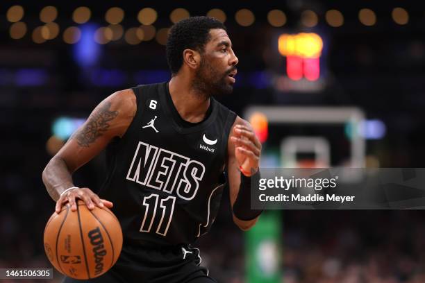 Kyrie Irving of the Brooklyn Nets dribbles against the Boston Celtics during the first half at TD Garden on February 01, 2023 in Boston,...