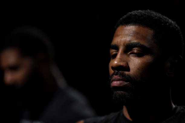 Kyrie Irving of the Brooklyn Nets looks on before the game against the Boston Celtics at TD Garden on February 01, 2023 in Boston, Massachusetts....