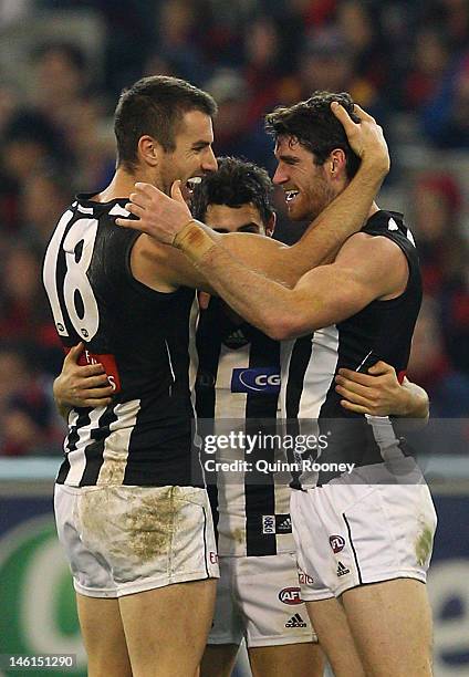 Tyson Goldsack of the Magpies is congratulated by team-mates after kicking a goal during the round 11 AFL match between the Melbourne Demons and the...