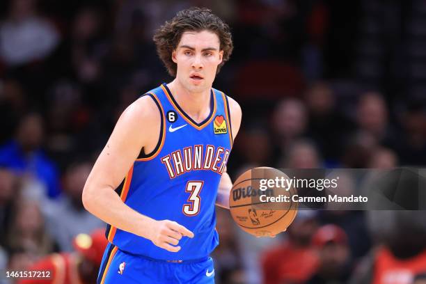 Josh Giddey of the Oklahoma City Thunder controls the ball against the Houston Rockets during the second half at Toyota Center on February 01, 2023...