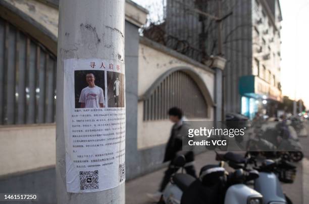 Missing persons poster of Hu Xinyu is seen on a telegraph pole on January 30, 2023 in Shangrao, Jiangxi Province of China. According to local police,...