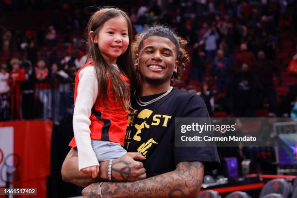 Jalen Green of the Houston Rockets greets a young fan during the second half at Toyota Center on February 01, 2023 in Houston, Texas. NOTE TO USER:...