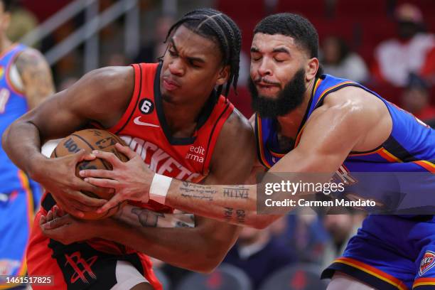 Josh Christopher of the Houston Rockets battles Kenrich Williams of the Oklahoma City Thunder for ball control during the second half at Toyota...