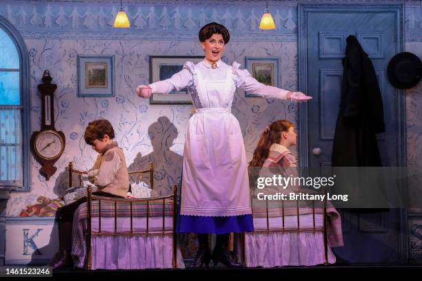 Sebastian Serko as Michael Banks, Stefanie Jones as Mary Poppins and Harriet Alder as Jane Banks perform during a media preview of "Mary Poppins" at...