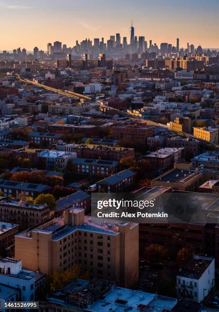 residential district in bushwick, brooklyn, new york, with the distant view on freedom tower in lower manhattan. high-resolution vertical stitched panorama. - lower house imagens e fotografias de stock