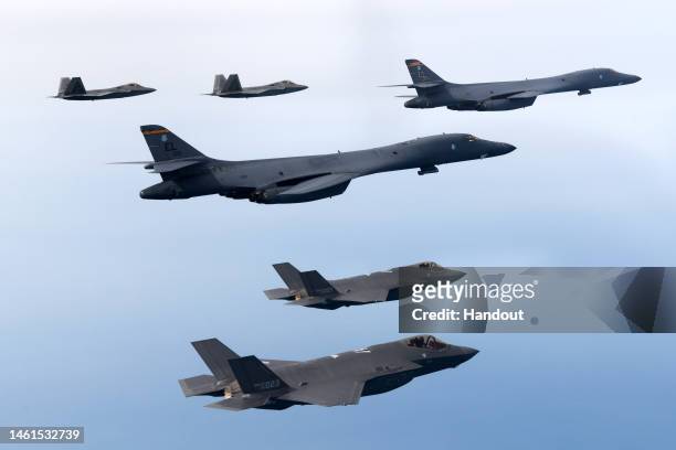 In this handout image released by the South Korean Defense Ministry, U.S. Air Force B-1B bombers , F-22 fighter jets and South Korean Air Force F-35...