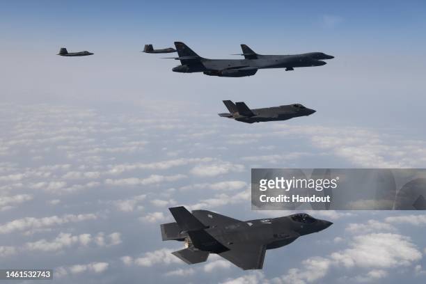 In this handout image released by the South Korean Defense Ministry, U.S. Air Force B-1B bombers , F-22 fighter jets and South Korean Air Force F-35...
