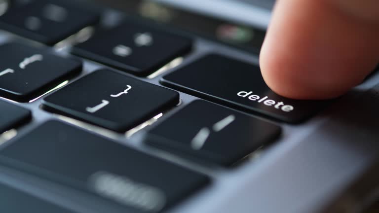 Delete Definition Computer Finger of the computer user, he presses the delete button on the ...