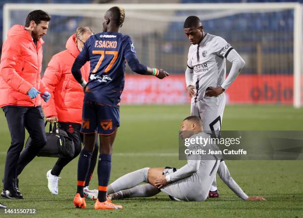 Injured, Kylian Mbappe of PSG has to leave the pitch during the Ligue 1 match between Montpellier HSC and Paris Saint-Germain at Stade de la Mosson...