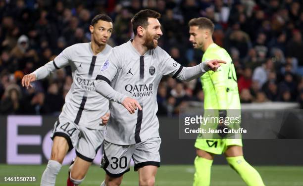 Lionel Messi of PSG celebrates his goal with Hugo Ekitike while Montpellier goalkeeper Benjamin Lecomte looks on during the Ligue 1 match between...