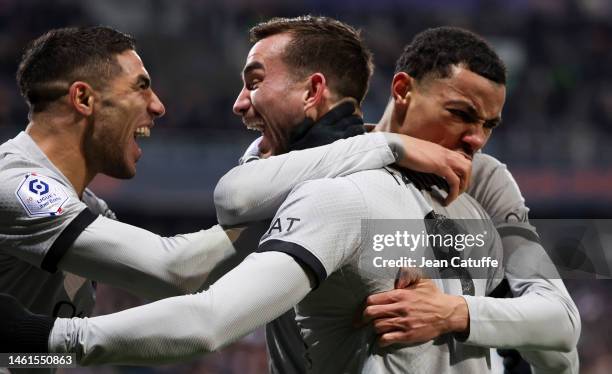 Fabian Ruiz Pena of PSG celebrates his goal between Achraf Hakimi and Hugo Ekitike during the Ligue 1 match between Montpellier HSC and Paris...