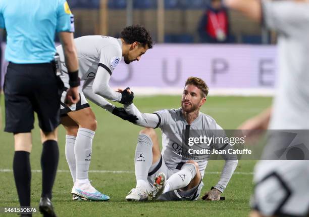 Injured, Sergio Ramos of PSG - here helped by Marquinhos - has to leave the pitch during the Ligue 1 match between Montpellier HSC and Paris...