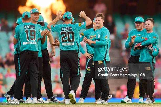 Matt Kuhnemann of the Heat celebrates with team mates after taking the wicket of Josh Philippe of the Sixers during the Men's Big Bash League match...