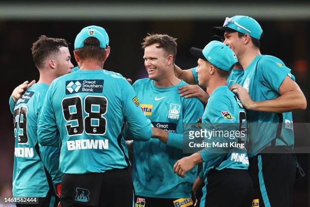Matt Kuhnemann of the Heat celebrates with team mates after taking the wicket of Josh Philippe of the Sixers during the Men's Big Bash League match...