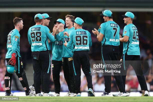 Matt Kuhnemann of the Heat celebrates with team mates after taking the wicket of Josh Philippe of the Sixers during the Men's Big Bash League match...