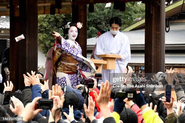 Maiko throw bags containing beans during a bean-scattering ceremony 'Setsubun Festival' at Yasaka Jinja Shrine ahead of the Setsubun, end of winter...