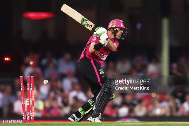 Daniel Hughes of the Sixers is bowled by Matt Kuhnemann of the Heat during the Men's Big Bash League match between the Sydney Sixers and the Brisbane...