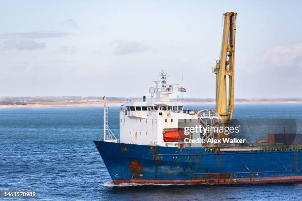 large cargo ship with crane in coastal waters - ships bridge 個照片及圖片檔