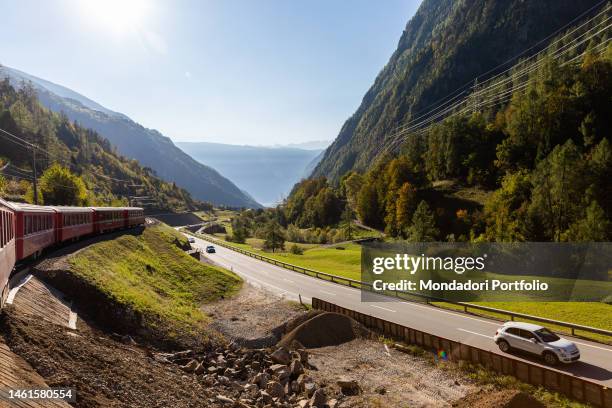 The passage of the Red Train of Bernina in the railway section located between Brusio and Poschiavo. Brusio , October 17th, 2021 SPECIAL FEE -...