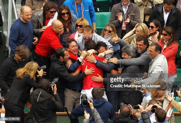 Rafael Nadal of Spain celebrates victory with friends and family after the men's singles final against Novak Djokovic of Serbia during day 16 of the...