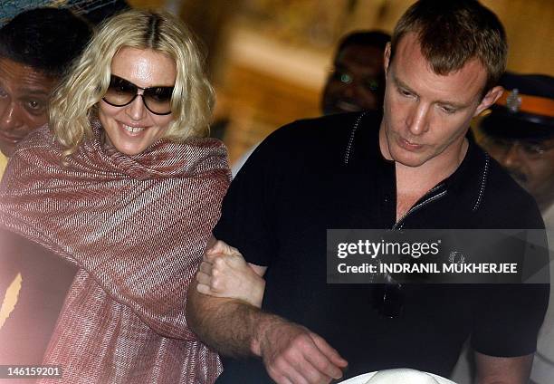 Multiple Grammy award winning pop star Madonna and her director husband Guy Ritchie leave the historic Presbyterian Church of St John the Evangelist,...