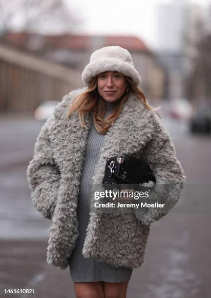 Sonia Lyson seen wearing Louis Vuitton black leather logo pattern bag, Edited grey short knit dress, Monki fluffy grey teddy jacket, H&M beige teddy...