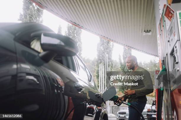 Getting Gas People Gas Station Photos and Premium High Res Pictures - Getty Images