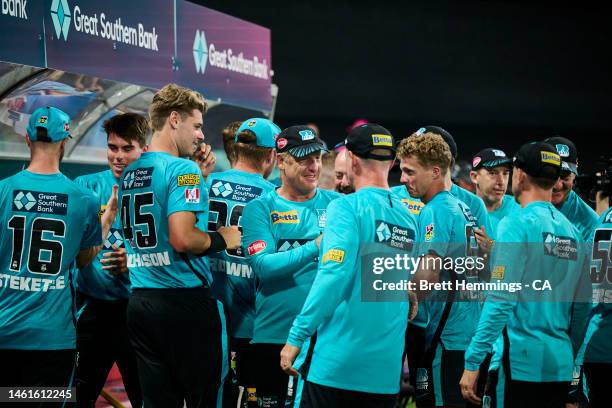 Team members of the Heat celebrate victory during the Men's Big Bash League match between the Sydney Sixers and the Brisbane Heat at Sydney Cricket...