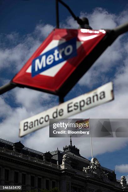 Metro sign for the 'Banco de Espana' station, is seen near to the Bank of Spain, or central bank, in Madrid, Spain, on Monday, June 11, 2012....