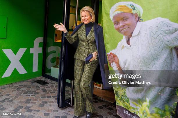 Queen Mathilde of Belgium greets her fans during a visit to the OXFAM world shop on January 2, 2023 in Mechelen, Belgium. The Queen will be informed...