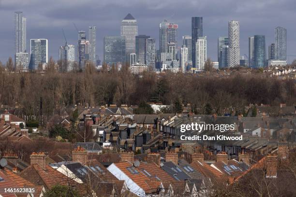 The Canary Wharf business district looms over rows of housing on February 02, 2023 in London, England. Today, the Bank of England upped its base...