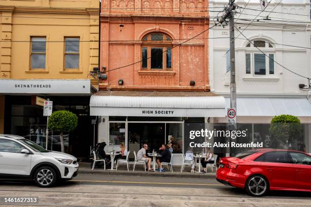 People sit at High Society cafe on February 02, 2023 in Melbourne, Australia. On July 6, 2022 the Australian government lifted all COVID-19...