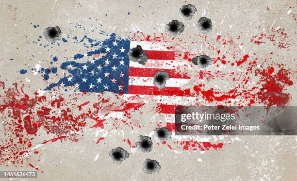 wall with splattered us flag paint and bullet holes - bullet holes stock-fotos und bilder