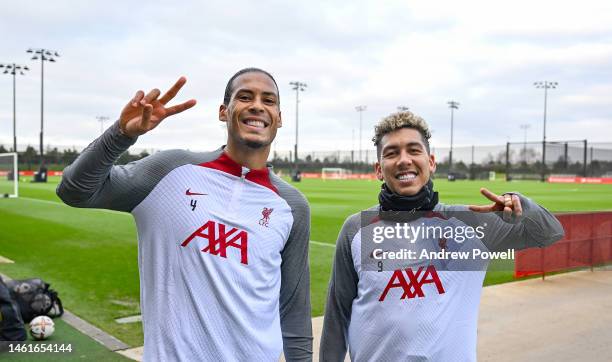 Virgil van Dijk and Roberto Firmino of Liverpool during a training session at AXA Training Centre on February 02, 2023 in Kirkby, England.